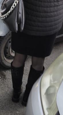 Girl in black pantyhose and suede boots